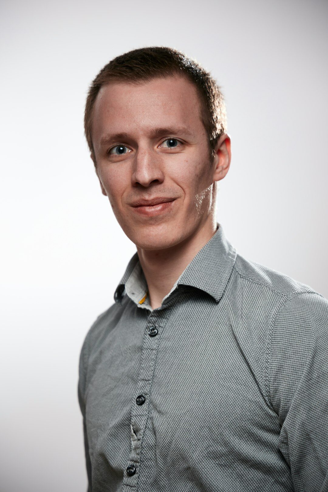 Studio portrait of a young man in a casual shirt